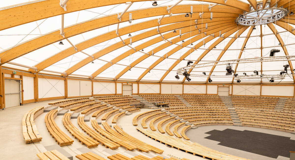 Glulam structure with tensile roof for this amphitheatre