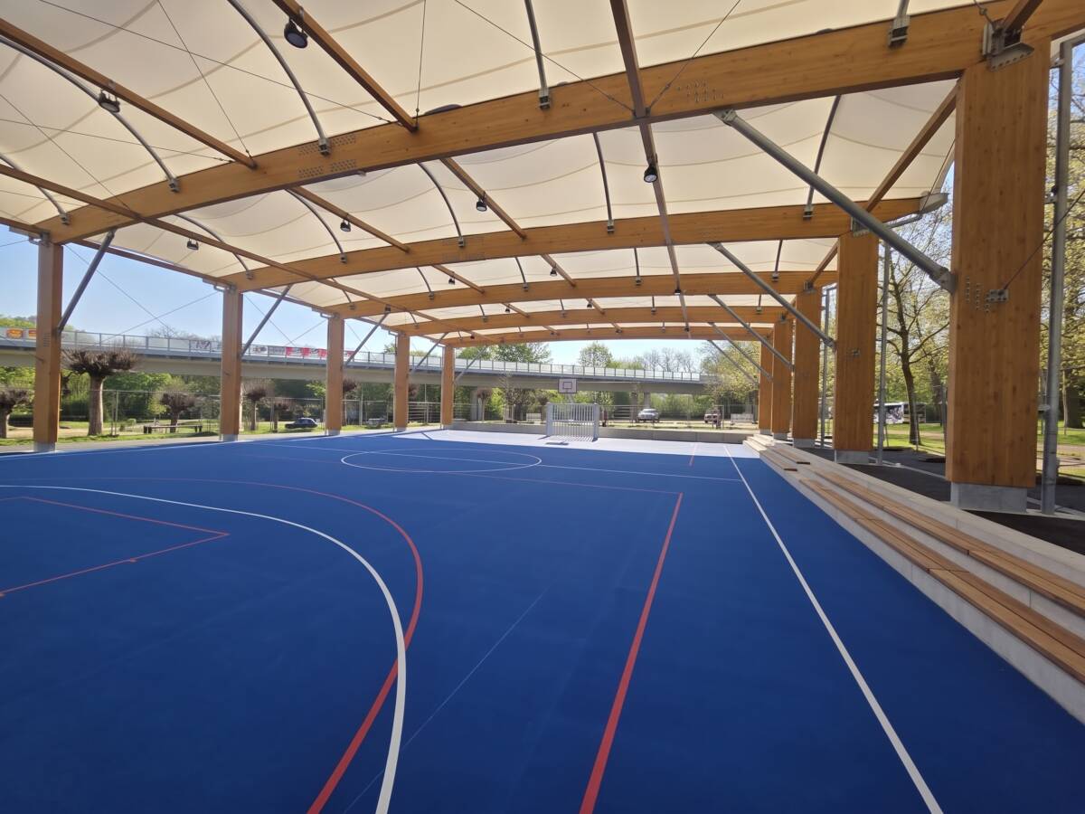 Hybrid timber and galvanised steel frame with translucent tensile membrane roof